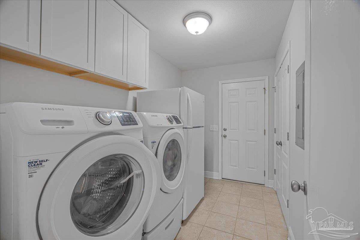 5997 Stonechase Boulevard Pace, FL 32571 - Photo 40 of 52 a utility room with dryer and washer