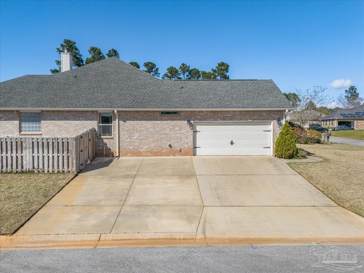 5997 Stonechase Boulevard Pace, FL 32571 - Photo 4 of 52 a view of a house with a garage