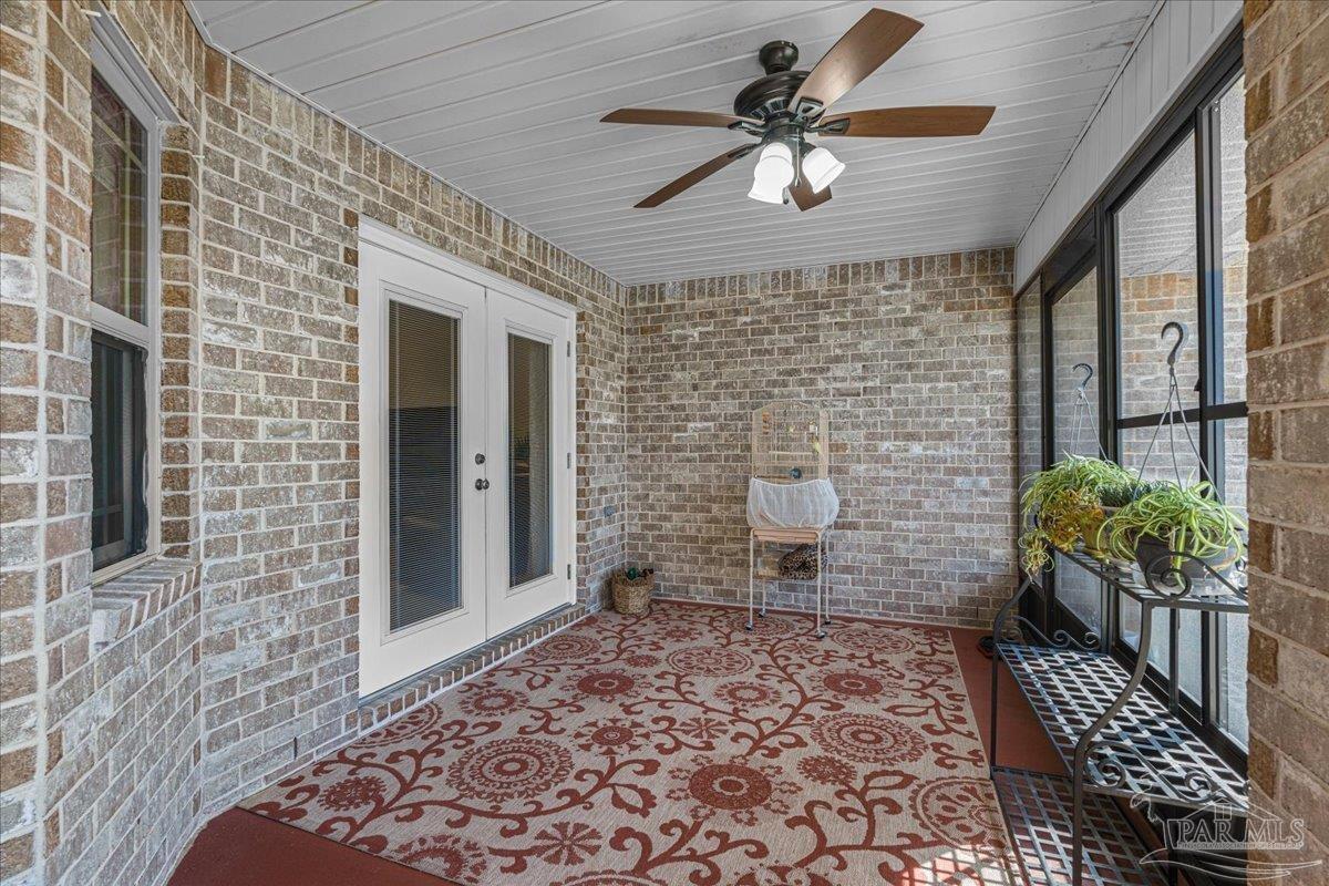 5997 Stonechase Boulevard Pace, FL 32571 - Photo 41 of 52 a brick building with a large window