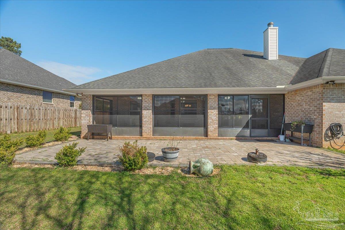 5997 Stonechase Boulevard Pace, FL 32571 - Photo 43 of 52 a front view of a house with garden