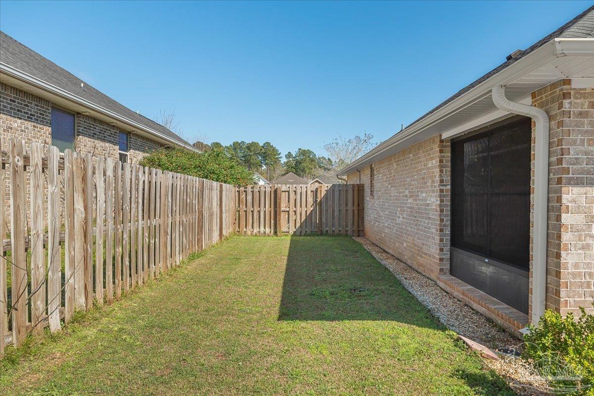 5997 Stonechase Boulevard Pace, FL 32571 - Photo 44 of 52 a backyard of a house
