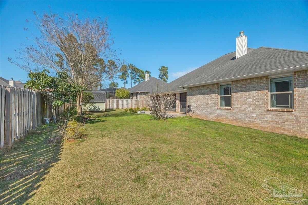 5997 Stonechase Boulevard Pace, FL 32571 - Photo 45 of 52 a front view of a house with garden