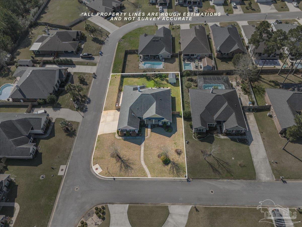 5997 Stonechase Boulevard Pace, FL 32571 - Photo 48 of 52 an aerial view of a house with a swimming pool
