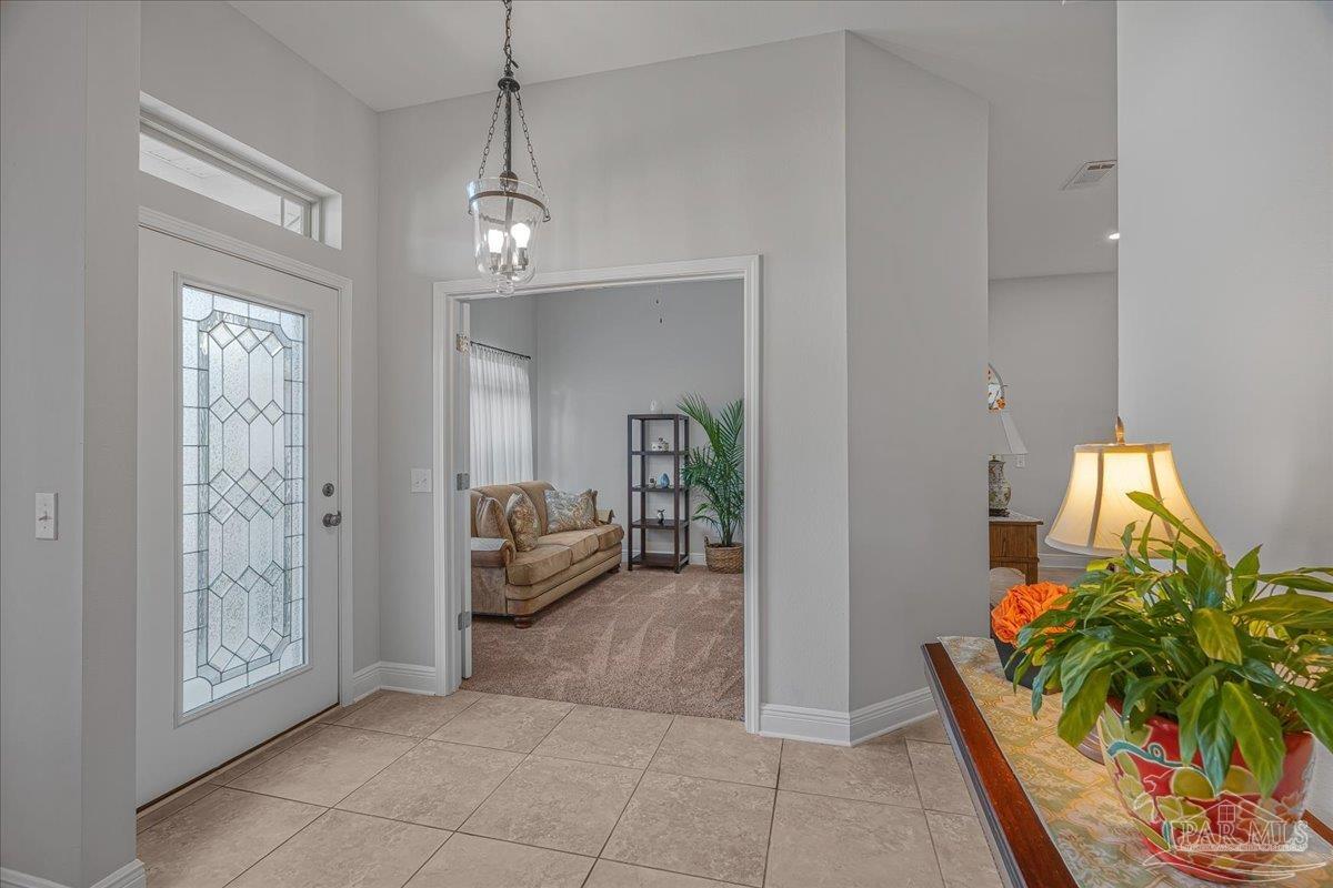 5997 Stonechase Boulevard Pace, FL 32571 - Photo 10 of 52 a view of a livingroom with furniture and entryway
