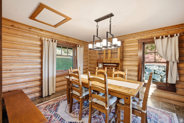 12465 Bone Road Kamas, UT 84036 - Photo 33 of 63 Log-clad walls, recessed ceiling light, and a modern linear chandelier
