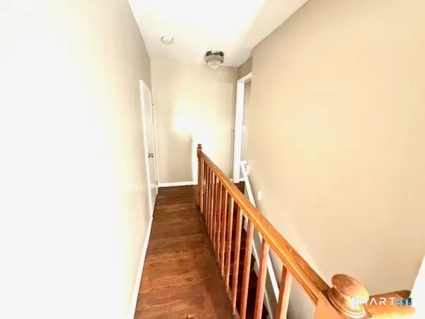 a bed room with a bed and a chair