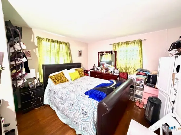 a room with furniture windows and a ceiling fan