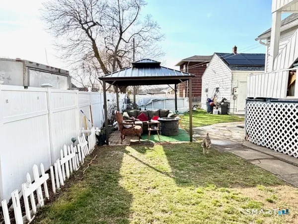 a view of a garage with a bike and chairs