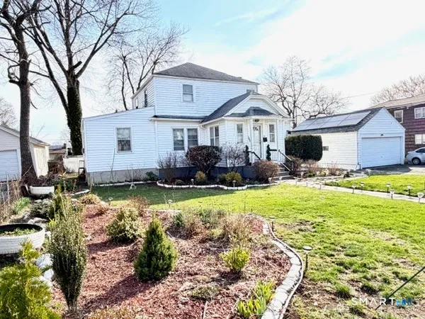 a view of a car parked in front of house