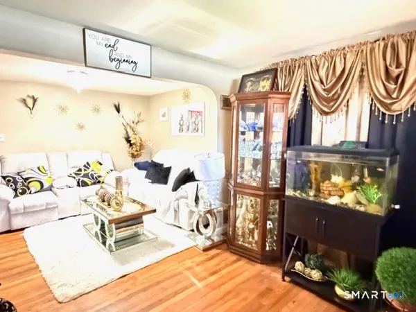 a kitchen with granite countertop a sink stove and refrigerator