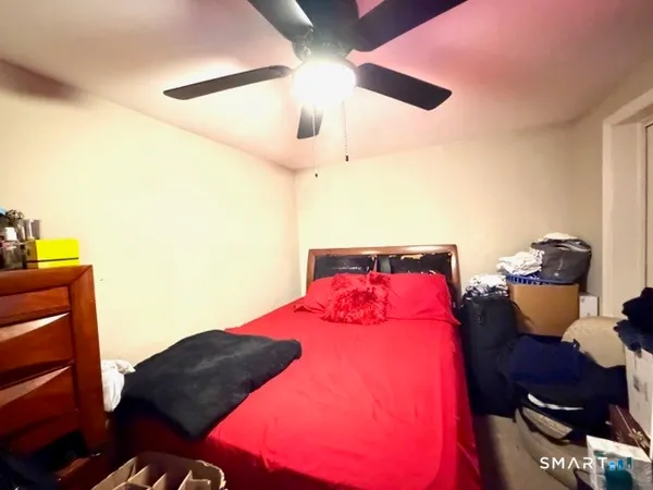 a room with a couch and a chandelier