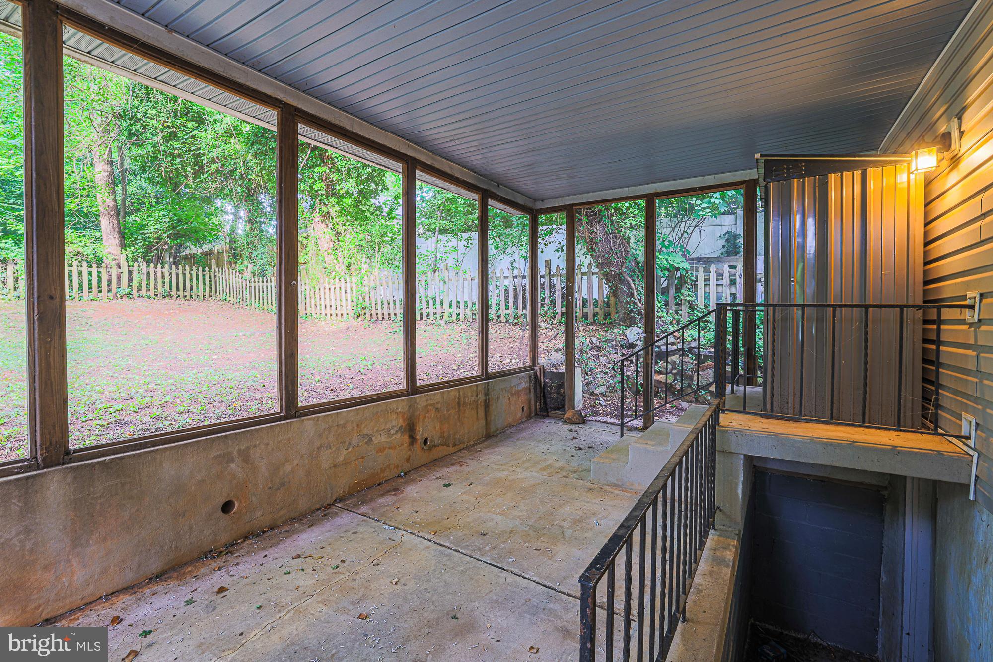 410 Kingston Road Baltimore, MD 21229 - Photo 46 of 56 Basement stairs and screened in porch