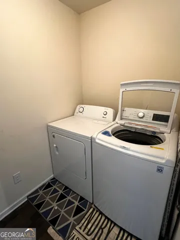 a utility room with dryer and washer