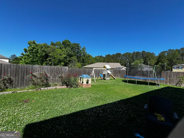 a view of a garden with an outdoor space