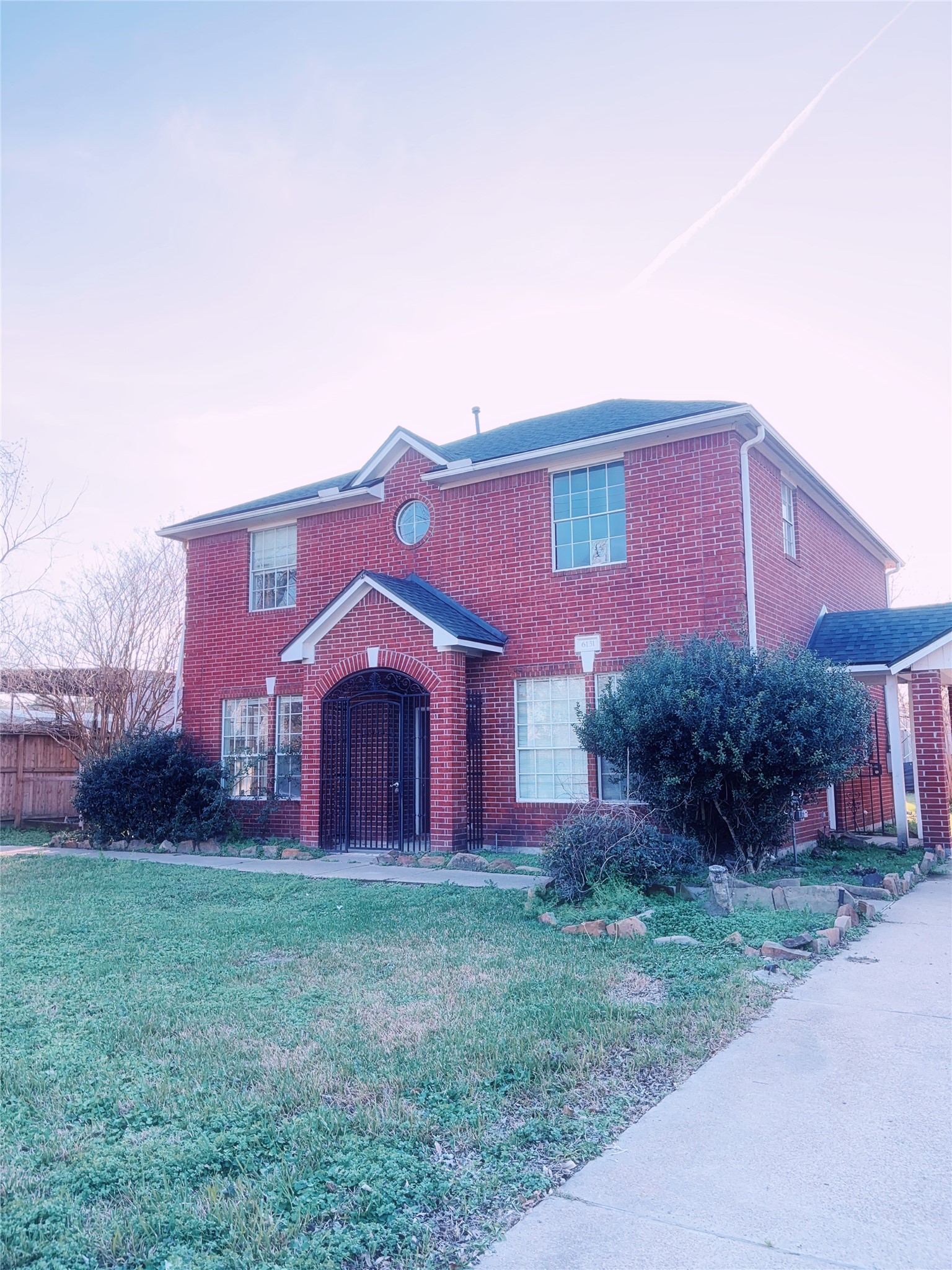 6131 East Houston Road Houston, TX 77028 - Photo 1 of 8 a front view of house with yard and green space