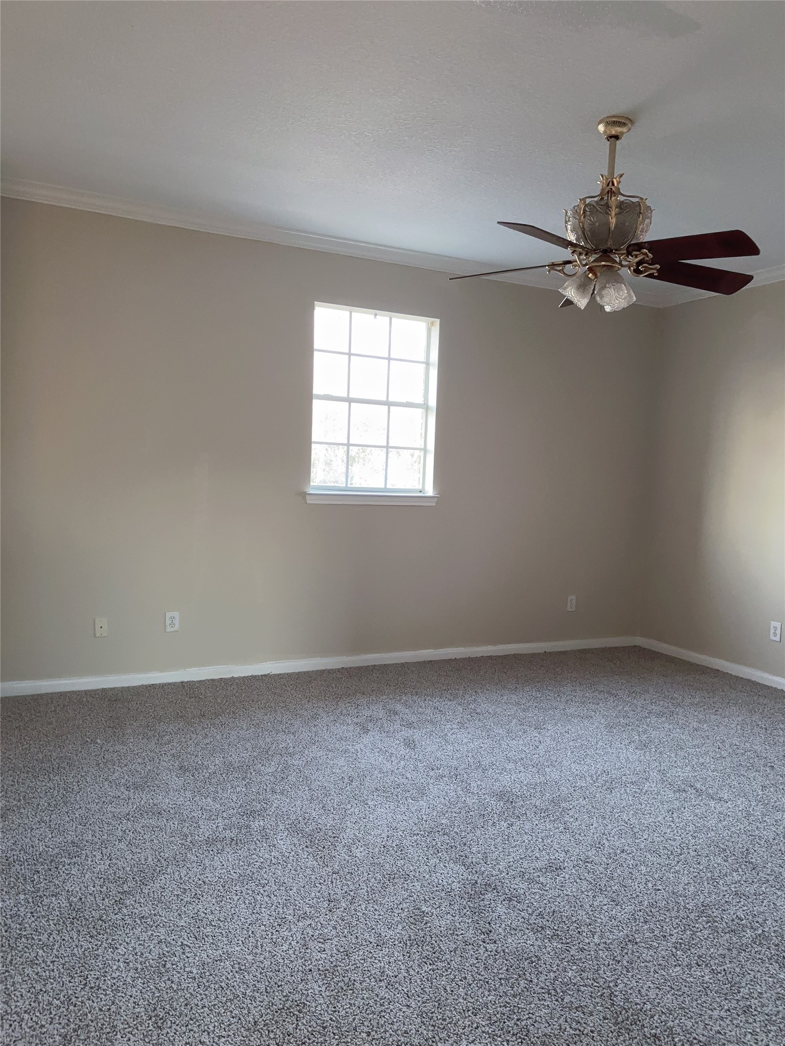 6131 East Houston Road Houston, TX 77028 - Photo 2 of 8 an empty room with windows and fan