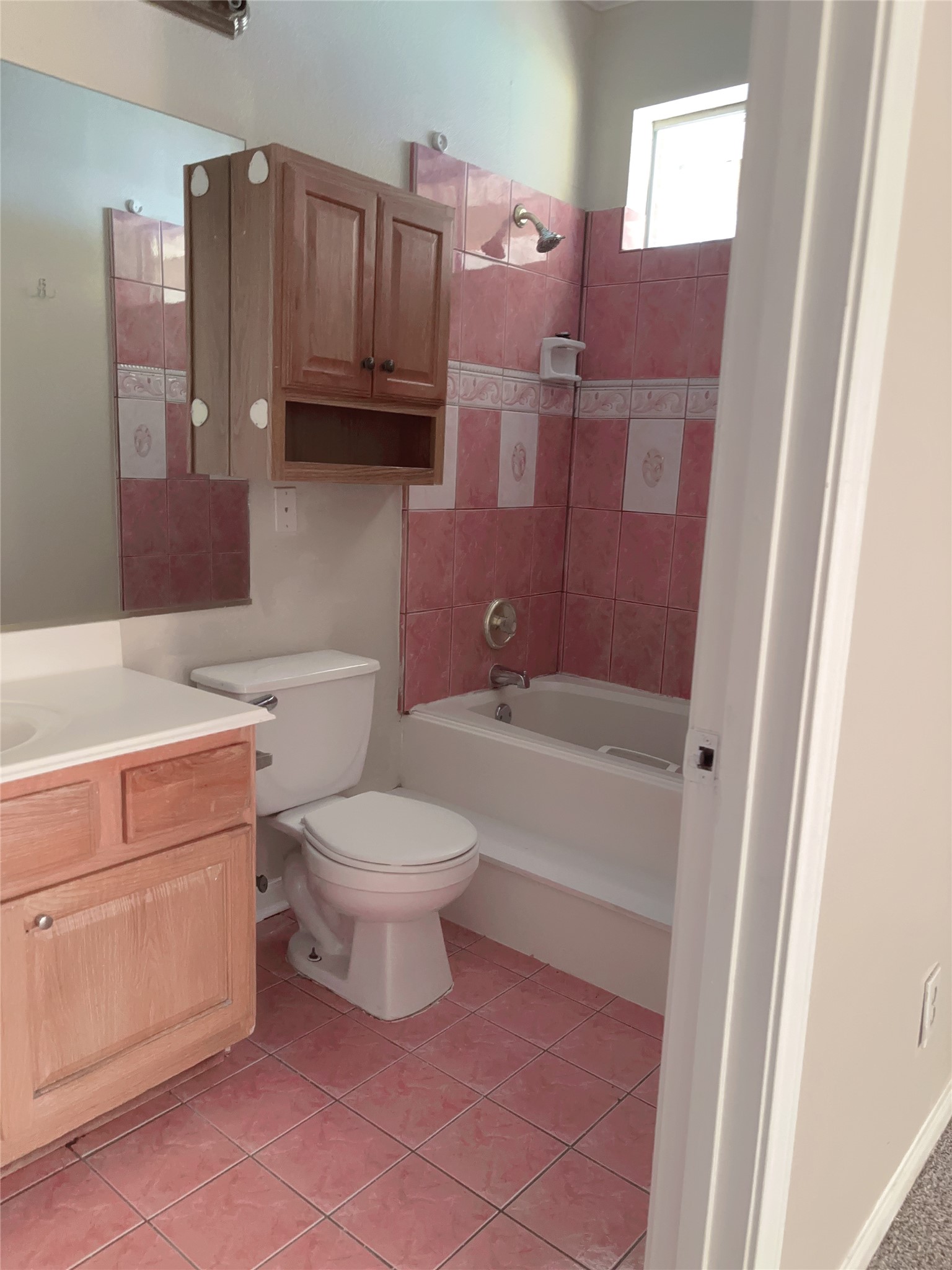 6131 East Houston Road Houston, TX 77028 - Photo 4 of 8 a bathroom with a toilet a sink and bathtub
