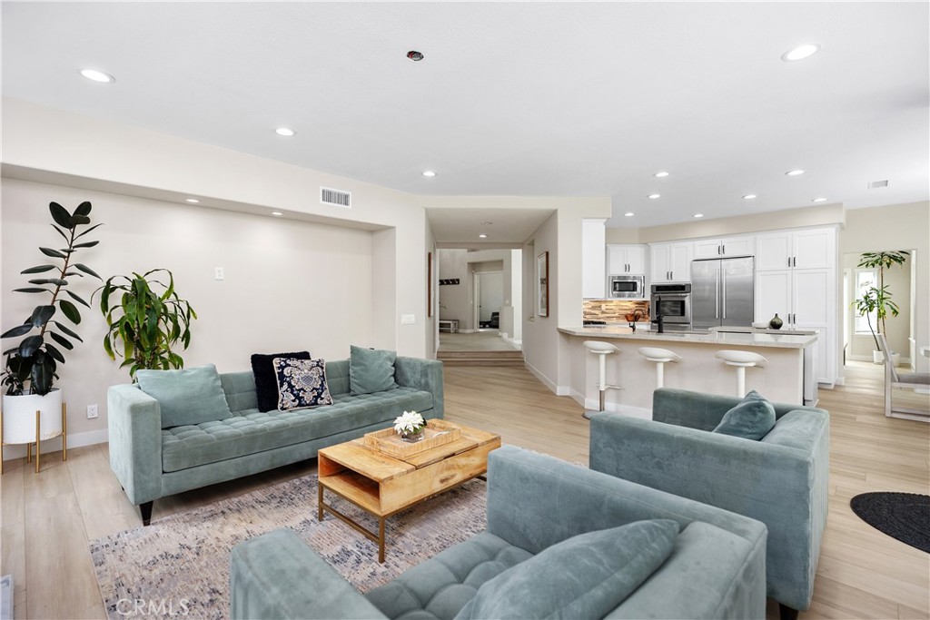 27121 Woodbluff Road Laguna Hills, CA 92653 - Photo 12 of 30 a living room with furniture and kitchen view