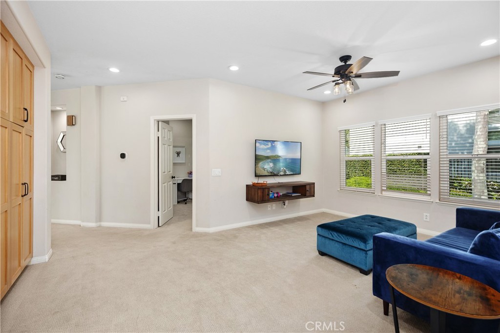 27121 Woodbluff Road Laguna Hills, CA 92653 - Photo 19 of 30 a living room with furniture and a flat screen tv