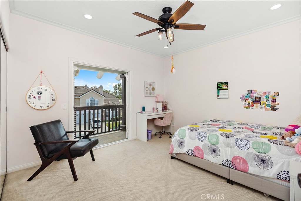 27121 Woodbluff Road Laguna Hills, CA 92653 - Photo 20 of 30 a bedroom with a bed a dresser and a window
