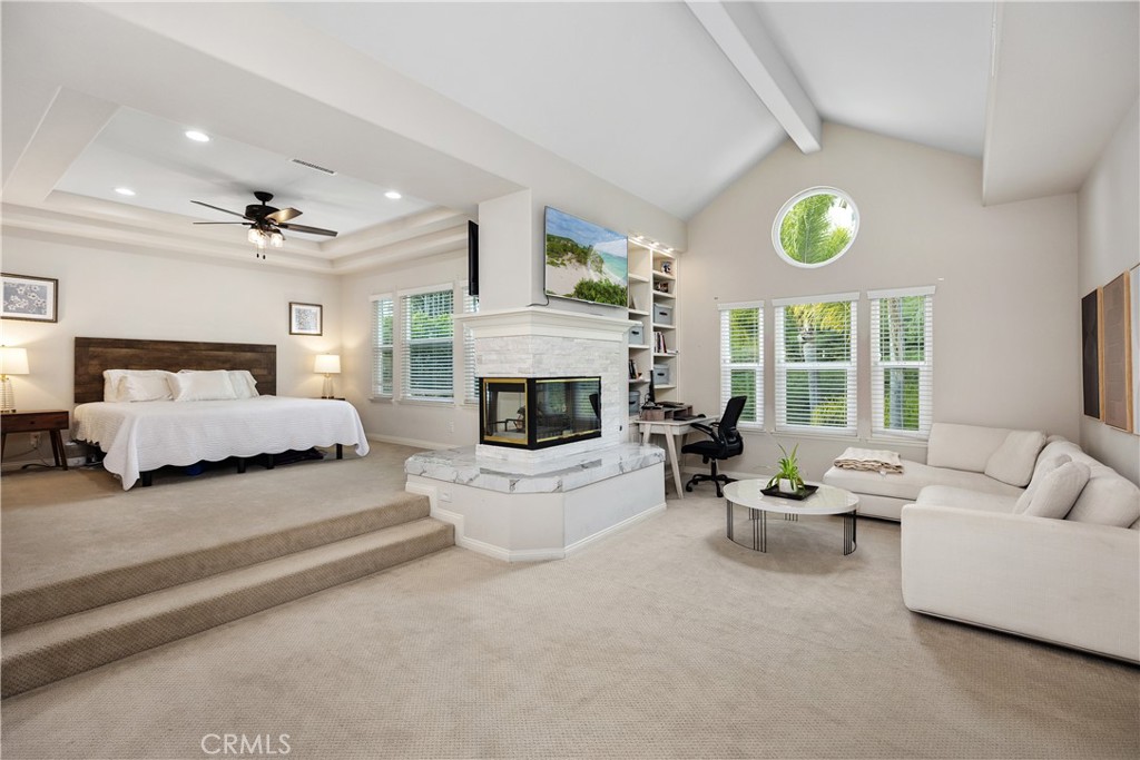 27121 Woodbluff Road Laguna Hills, CA 92653 - Photo 23 of 30 a living room with furniture and a fireplace