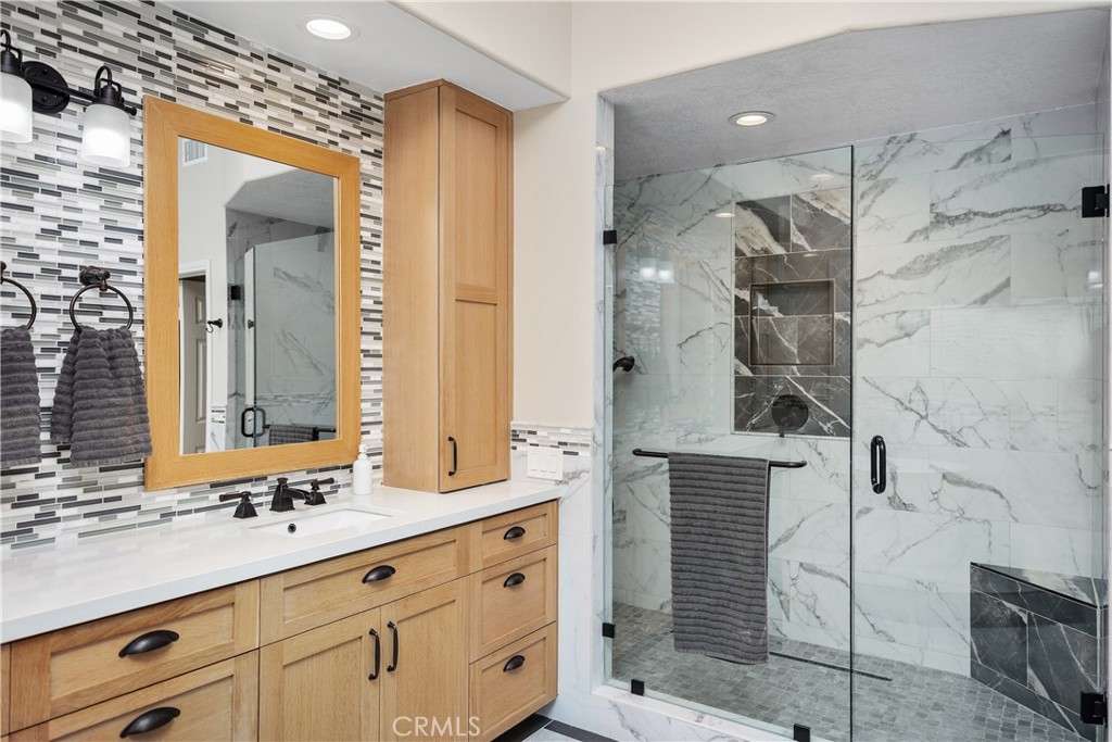 27121 Woodbluff Road Laguna Hills, CA 92653 - Photo 25 of 30 a bathroom with a double vanity sink mirror and double