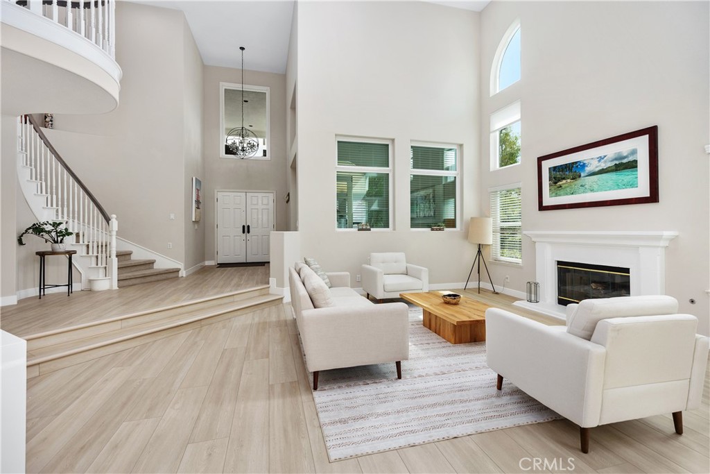 27121 Woodbluff Road Laguna Hills, CA 92653 - Photo 3 of 30 a living room with furniture and a fireplace