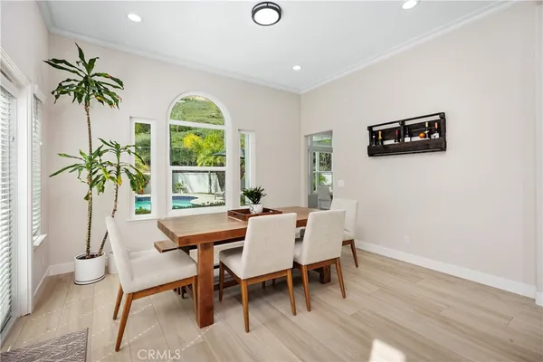 a view of a dining room with furniture window and outside view