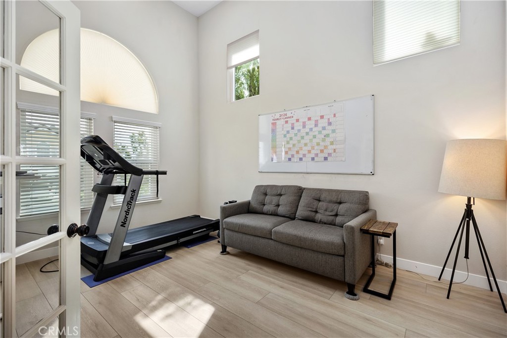 27121 Woodbluff Road Laguna Hills, CA 92653 - Photo 6 of 30 a living room with furniture a rug and a window
