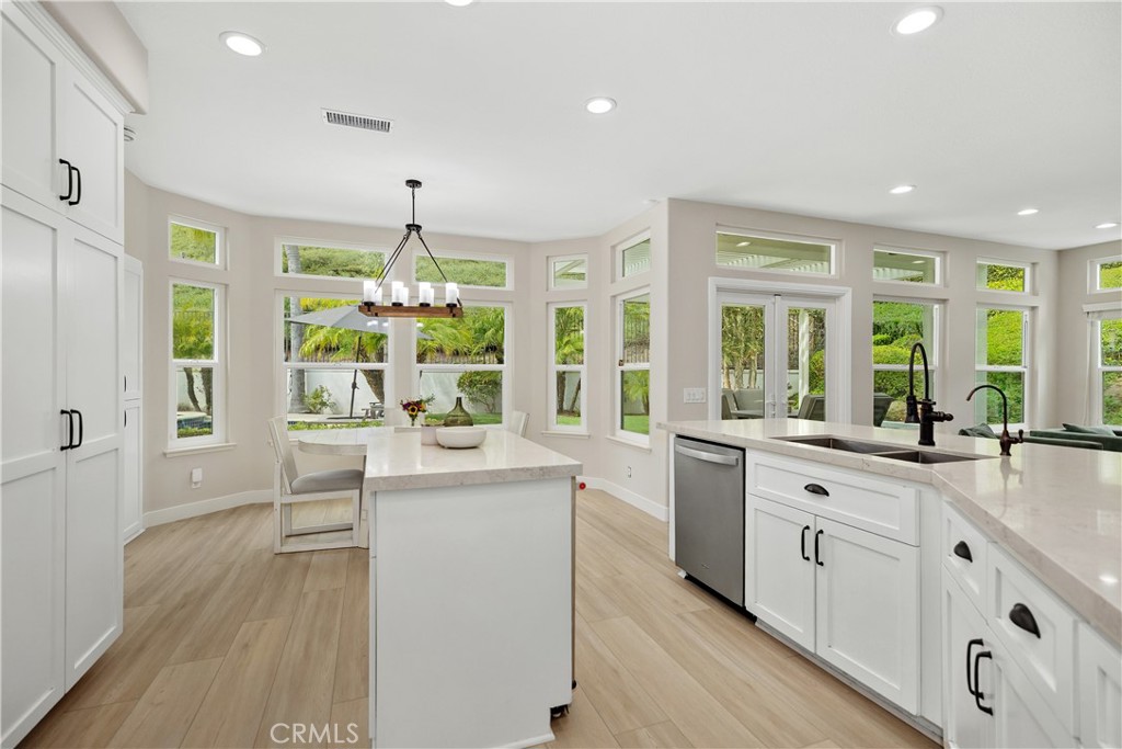 27121 Woodbluff Road Laguna Hills, CA 92653 - Photo 8 of 30 a kitchen with counter top space and wooden floor