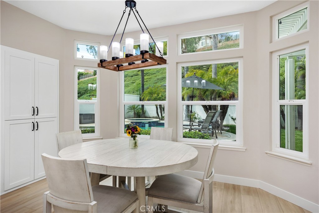 27121 Woodbluff Road Laguna Hills, CA 92653 - Photo 9 of 30 a view of a dining room with furniture window and outside view