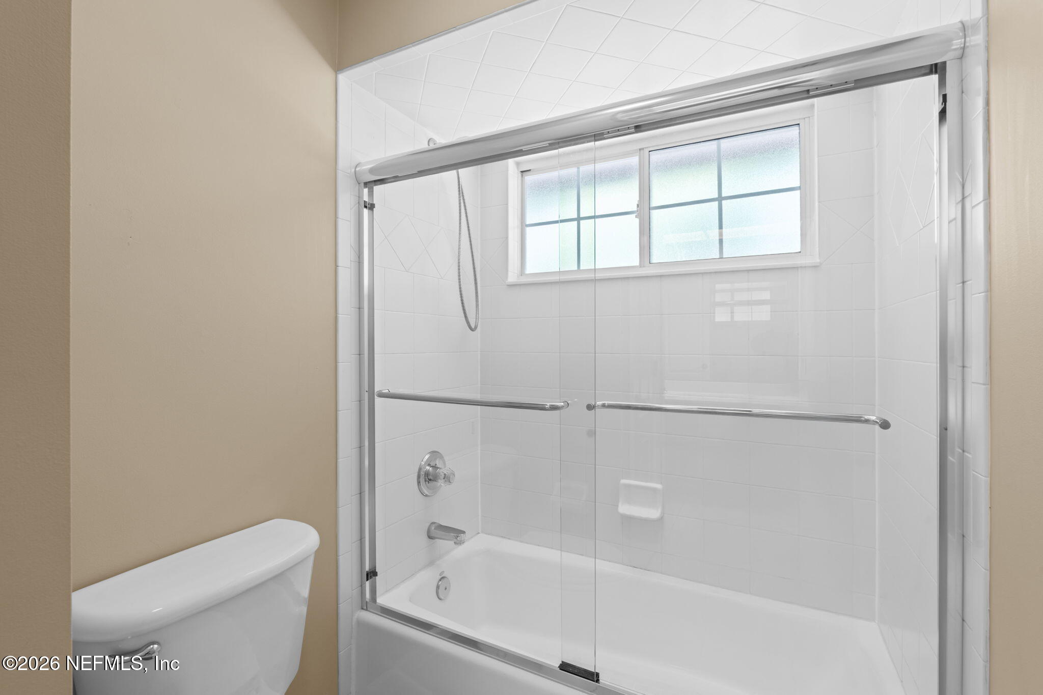 1600 Spring Water Court Fleming Island, FL 32003 - Photo 44 of 85 a white bath tub sitting next to a toilet