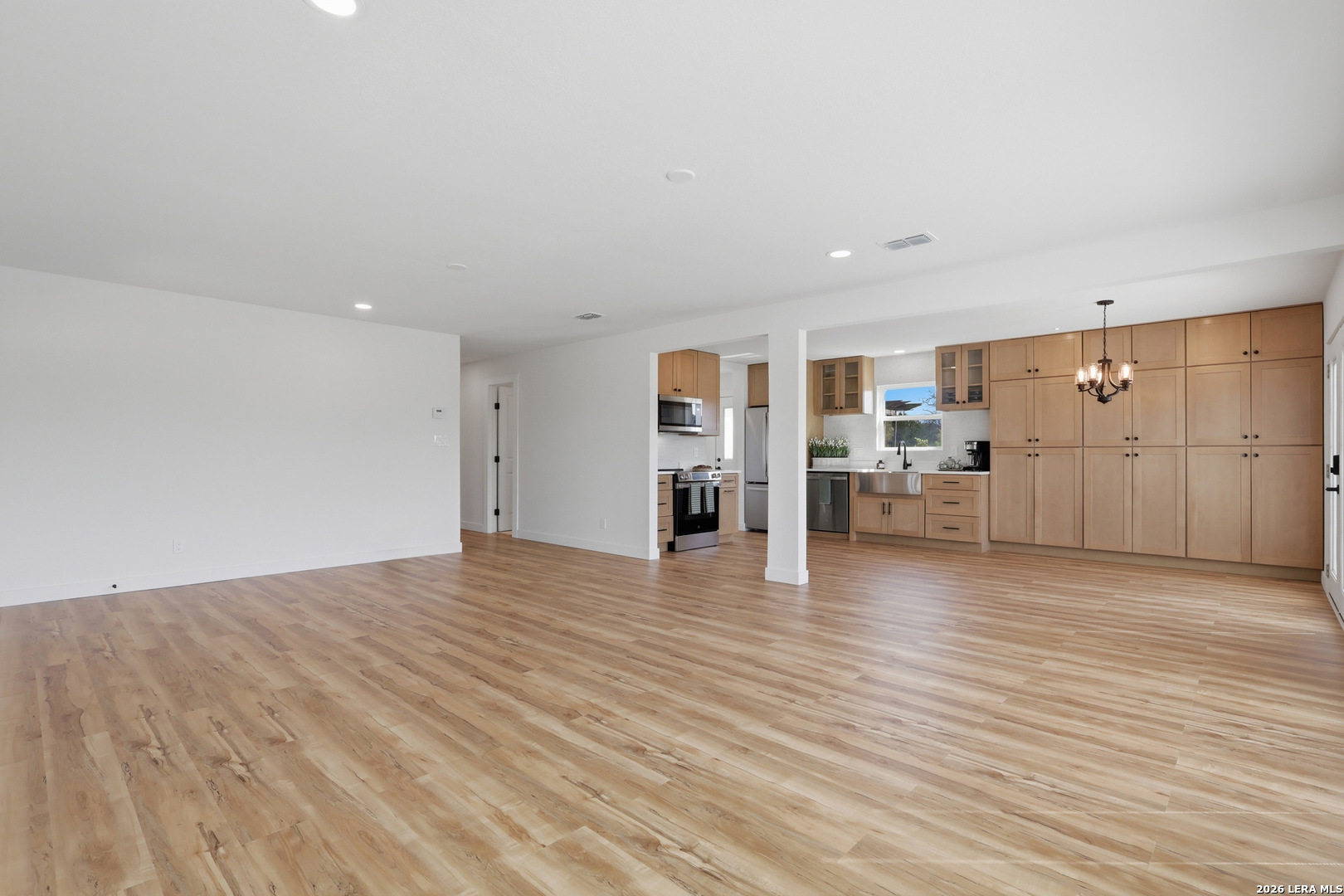 1333 Comanche Path Bandera, TX 78003 - Photo 12 of 41 a view of a kitchen with a sink and a refrigerator