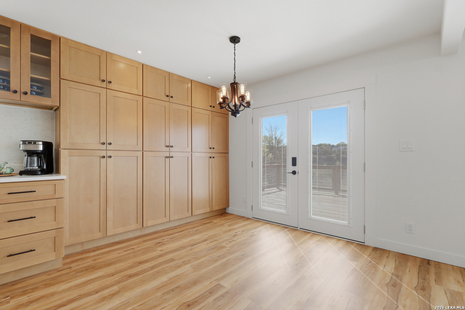 1333 Comanche Path Bandera, TX 78003 - Photo 15 of 41 a view of a kitchen with a dishwasher cabinets and wooden floor