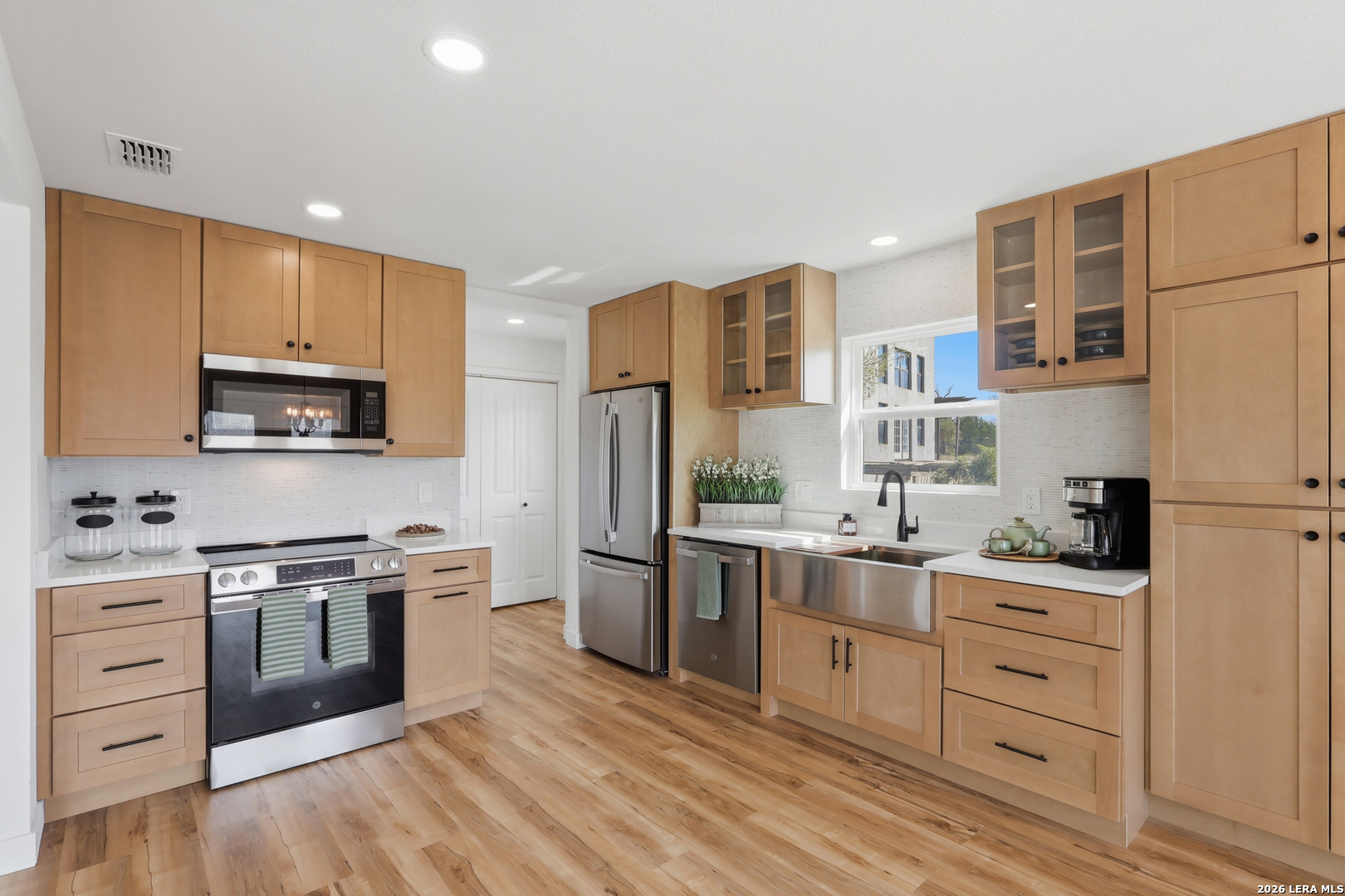 1333 Comanche Path Bandera, TX 78003 - Photo 17 of 41 a kitchen with stainless steel appliances a stove sink and refrigerator
