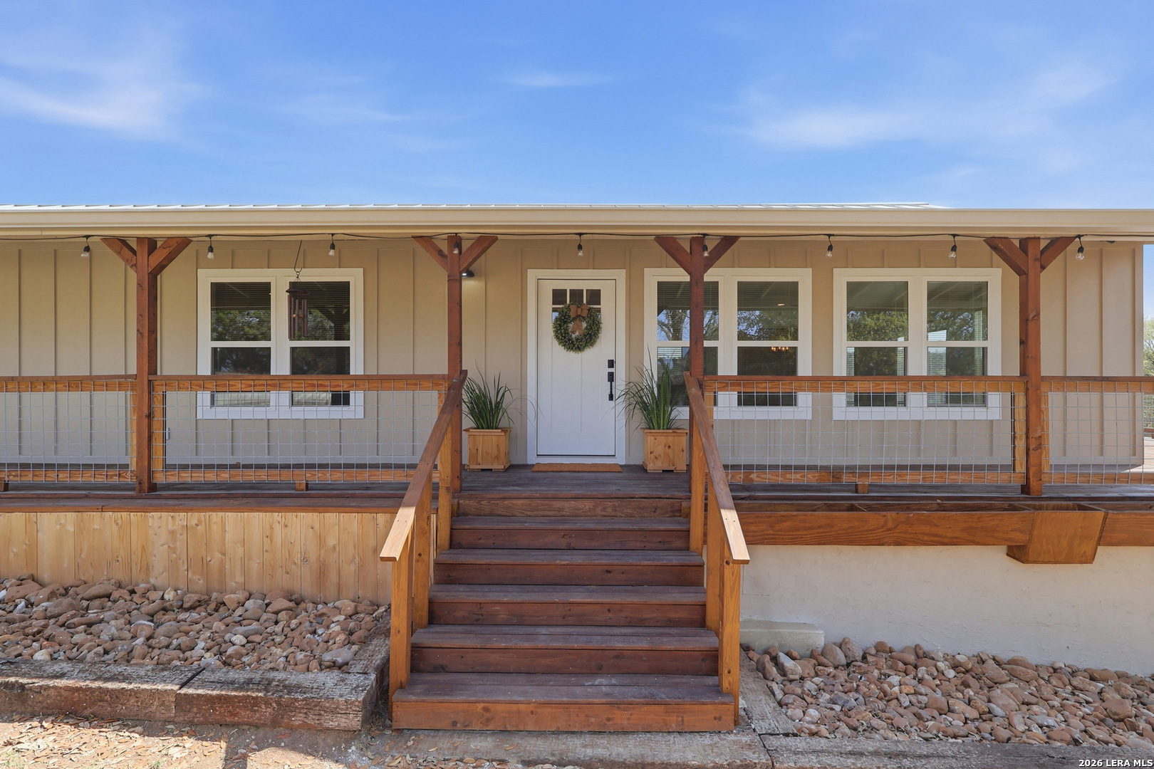 1333 Comanche Path Bandera, TX 78003 - Photo 2 of 41 a view of a house with wooden floor and a window