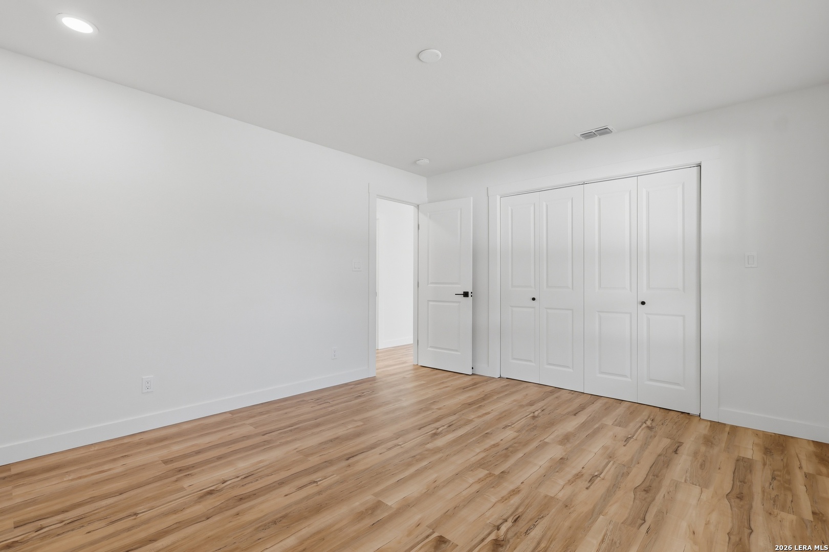 1333 Comanche Path Bandera, TX 78003 - Photo 21 of 41 a view of an empty room with wooden floor
