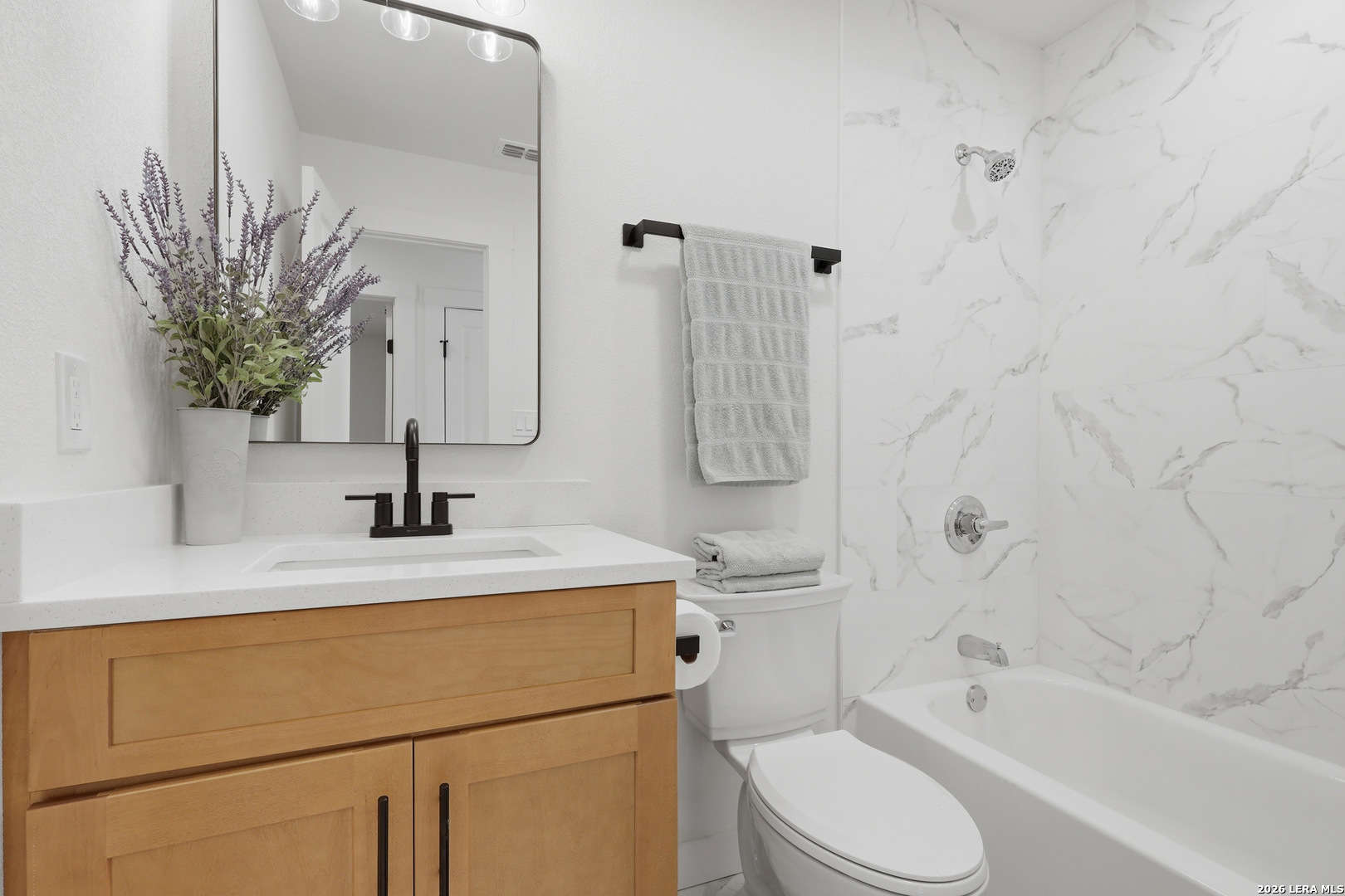 1333 Comanche Path Bandera, TX 78003 - Photo 22 of 41 a bathroom with a sink a toilet and shower