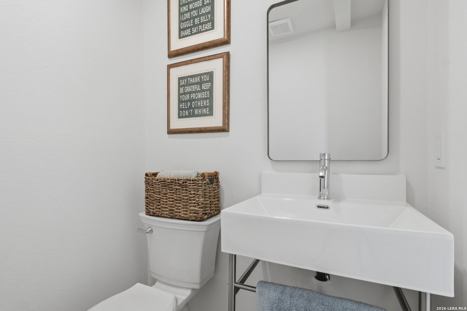 1333 Comanche Path Bandera, TX 78003 - Photo 25 of 41 a bathroom with a toilet sink and mirror