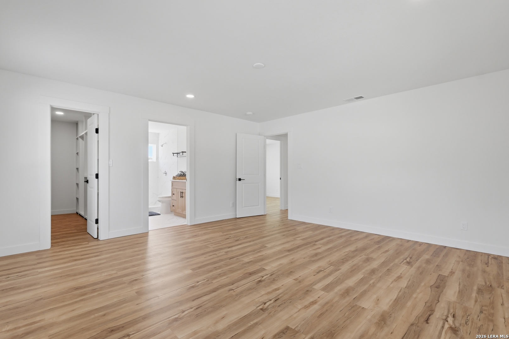 1333 Comanche Path Bandera, TX 78003 - Photo 29 of 41 a view of an empty room with wooden floor and closet