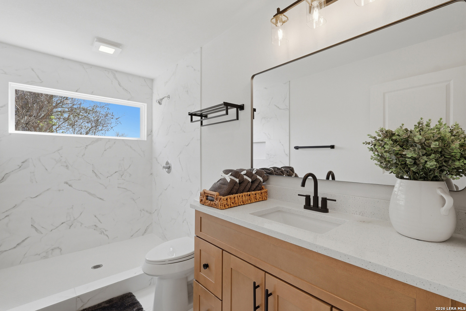 1333 Comanche Path Bandera, TX 78003 - Photo 30 of 41 a bathroom with a sink a toilet and shower