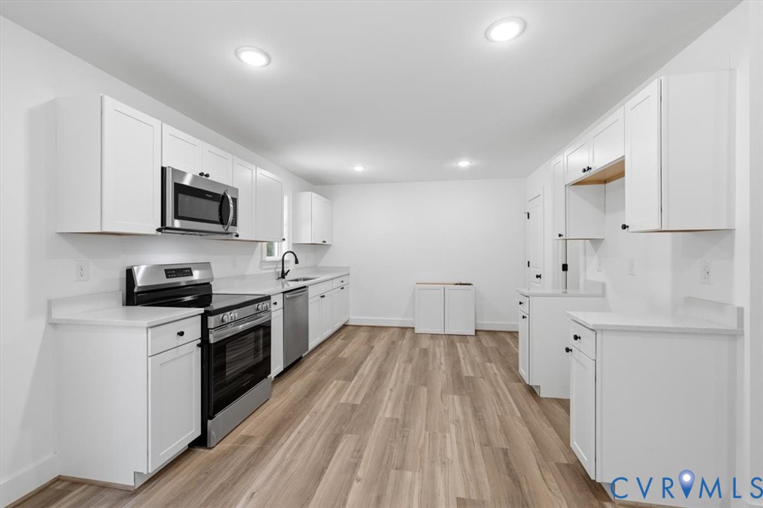 654 Frenchs Store Road Cumberland, VA 23040 - Photo 6 of 24 Bright kitchen featuring white shaker cabinetry, s