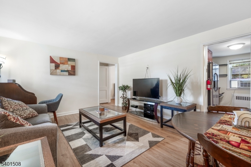445 Morris Avenue, Unit 4 Springfield, NJ 07081 - Photo 5 of 11 a living room with furniture and a flat screen tv
