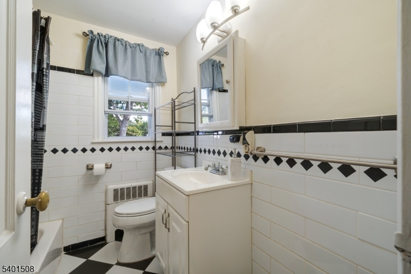 445 Morris Avenue, Unit 4 Springfield, NJ 07081 - Photo 8 of 11 a bathroom with a sink toilet and shower