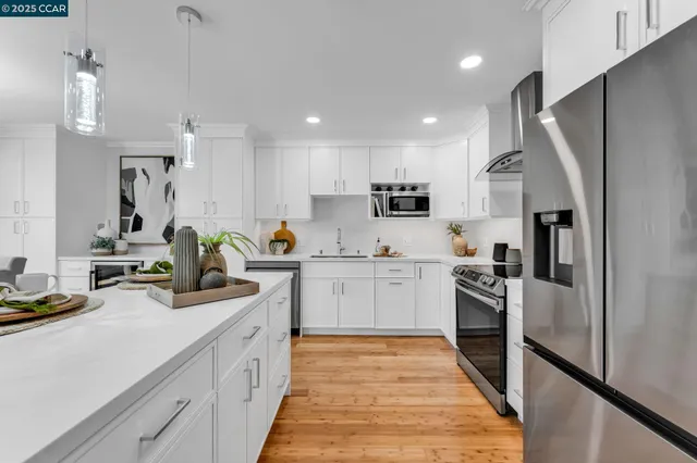 a kitchen with a stove and a refrigerator