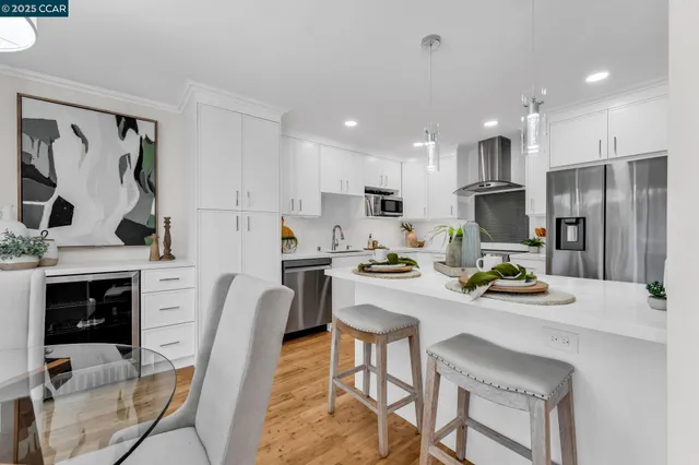 a dining room with furniture a window and wooden floor