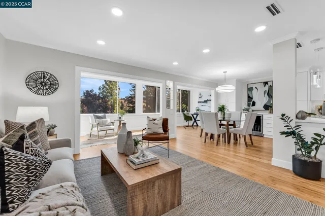 a living room with fireplace furniture and a flat screen tv