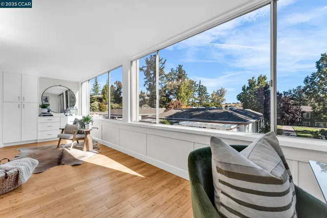 a bedroom with a bed and a potted plant