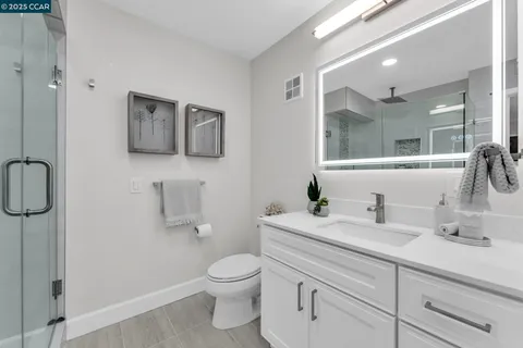 a bathroom with a shower and a toilet