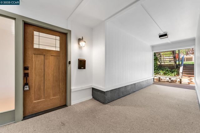 a view of a livingroom with furniture and a window